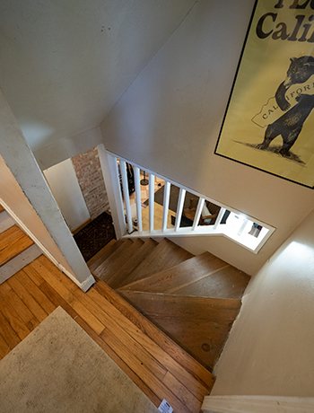 Stairs to Basement standing on landing between floors - 522 N Blackhawk Ave