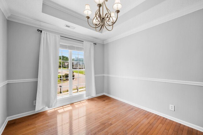 Building Photo - Stunning Stone Fireplace • Finished Basement • Fenced Yard