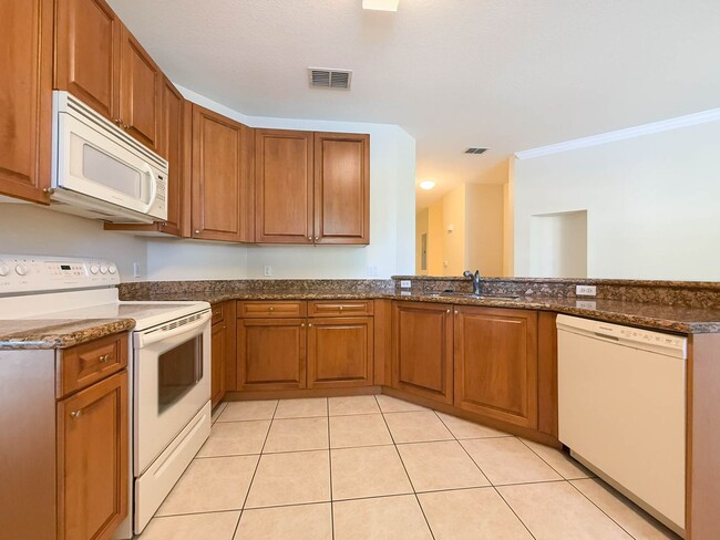 Building Photo - Beautiful 3-Bedroom Condo with 2-Car Garag...