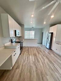 Building Photo - Available Now 2 Bedrooms 1.5 Baths 2 Assig...