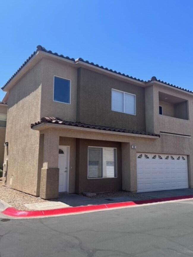 Building Photo - Three bedroom townhouse with 2 car garage