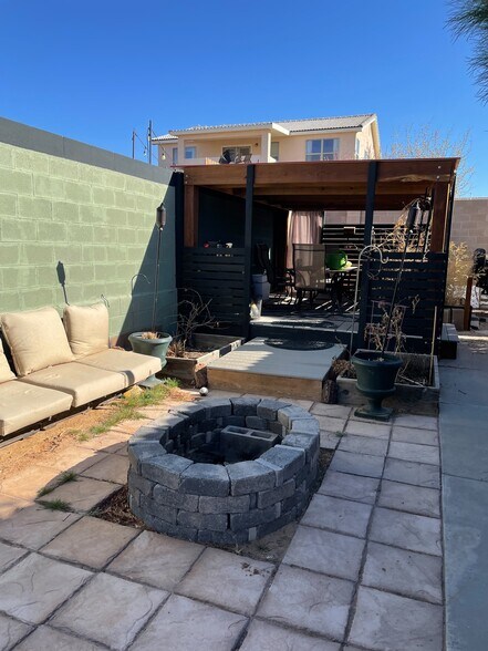 Outdoor living fire pit. Covered living?dining room - 2464 Tyler Loop NE