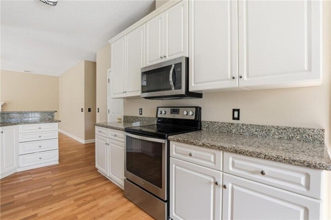 Building Photo - 4-Bedroom Home in Wild Heron with Front Porch and Fenced Yard