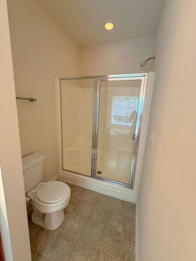 Building Photo - Beautifully updated Townhome! New cabinets, granite counter tops, and LVP flooring through downst...