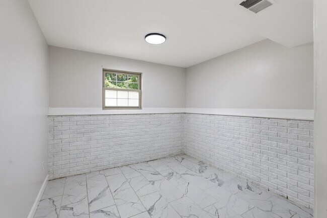 Building Photo - Experience contemporary living in this beautifully renovated residence where modern design meets ...