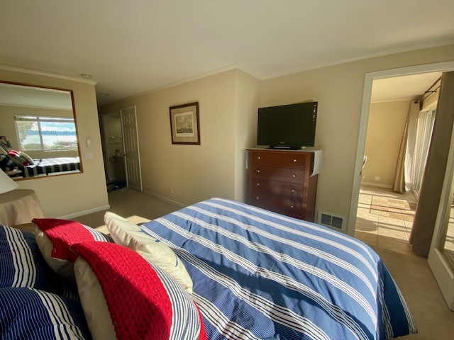 Master Bedroom with Large Mirror reflecting Lake back into the room - 6620 Lake Washington Blvd NE