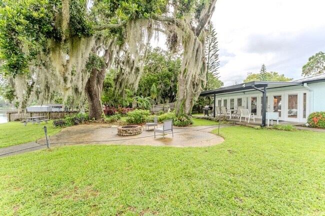 Building Photo - Lake Jessamine Luxury: Solar-Powered Waterfront Retreat on 1.14 Acres with Dock & Boathouse