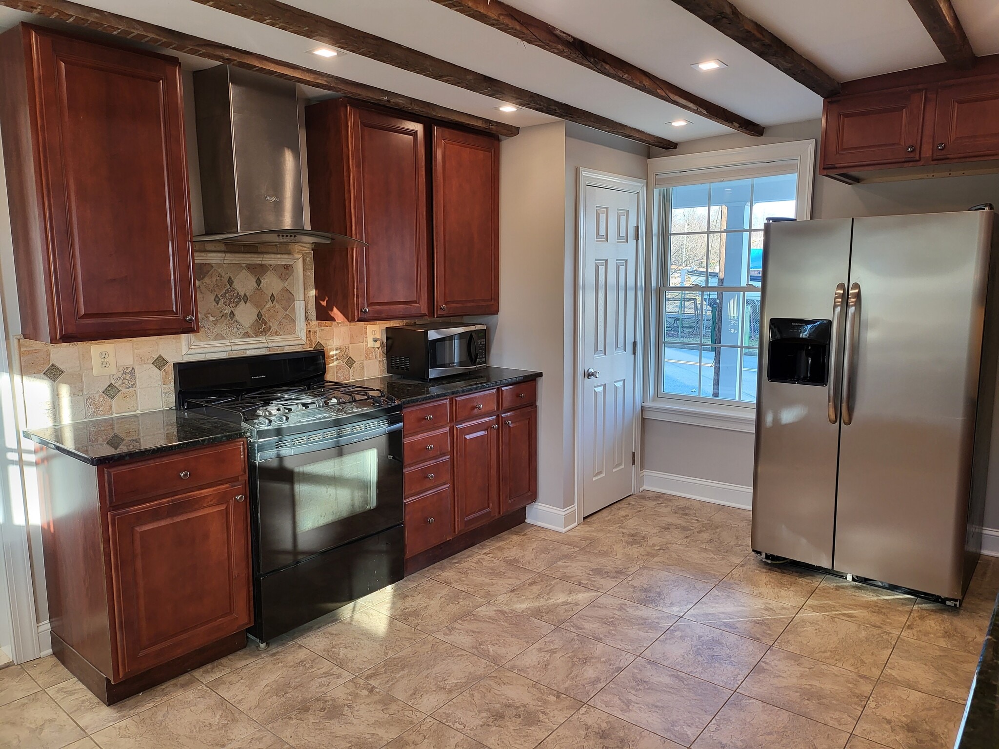 Stove and Fridge window facing Erie St - 731 N Stokes St
