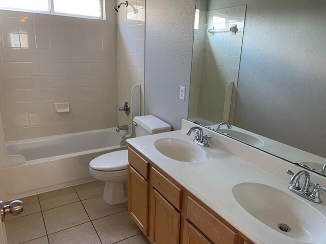 Building Photo - This beautiful home has 4 bedrooms, 2.1 baths and is perfect for an active family. There are thre...