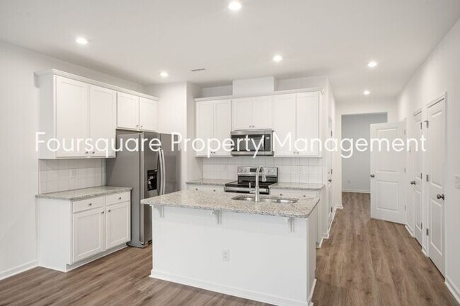 Building Photo - Spacious 3-Bed / 2.5-Bath Townhome with First-Floor Den, Hardwood Floors & 1-Car Garage – Wendell...