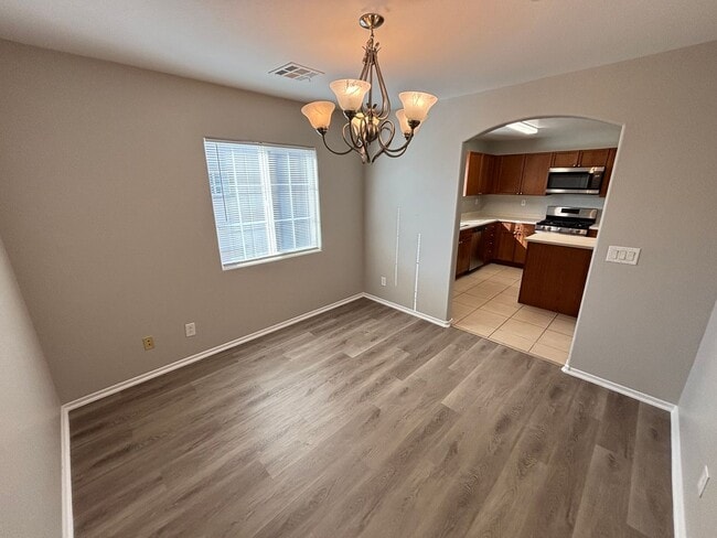 Building Photo - Spacious Tri-Level 4-Bedroom Home with Bal...