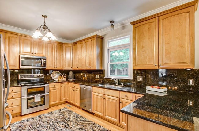 Building Photo - Spacious & Striking 3-story brick Executiv...