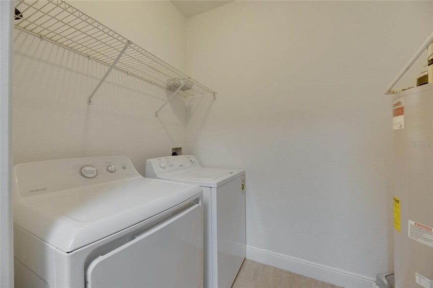 Washer and Dryer in utility room - 13016 Sanctuary Cove Dr