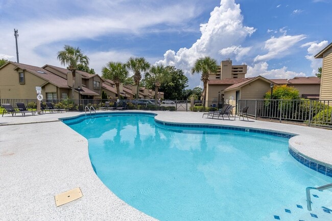 Building Photo - ONE FREE MONTH ON 13 MONTH LEASE! Welcome to this charming 3-bedroom, 2-bath condo located in the...