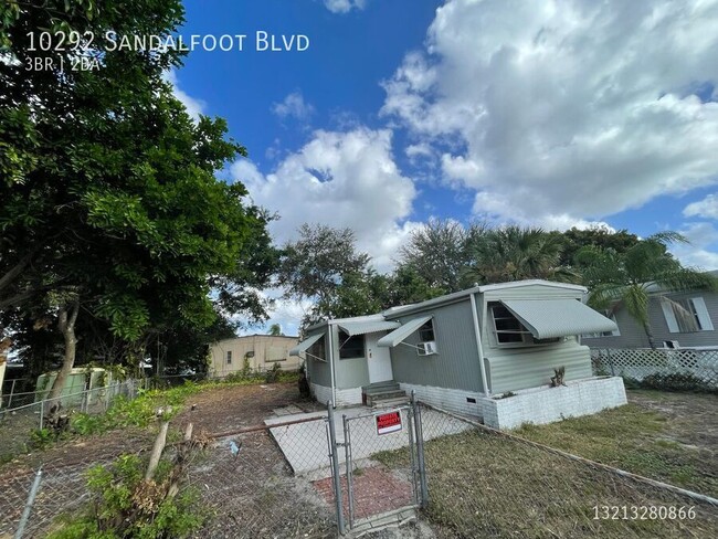 Building Photo - 10292 SW Sandalfoot Blvd