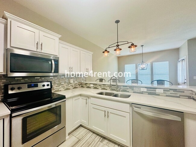 Building Photo - Ranch Style Home w/ Updated Kitchen, including SS Appliances and Granite Counters Plus a Large Un...