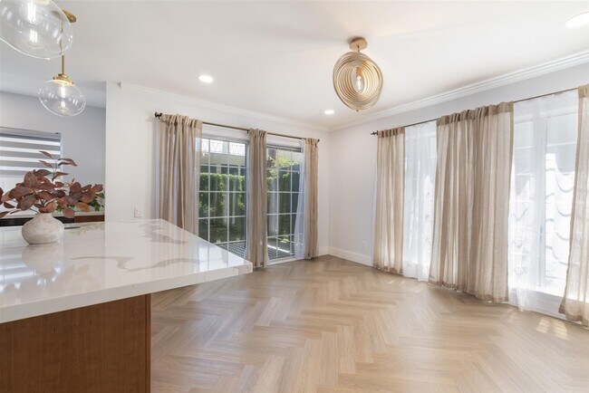 Light and views from kitchen to dining room - 8490 Fountain Ave