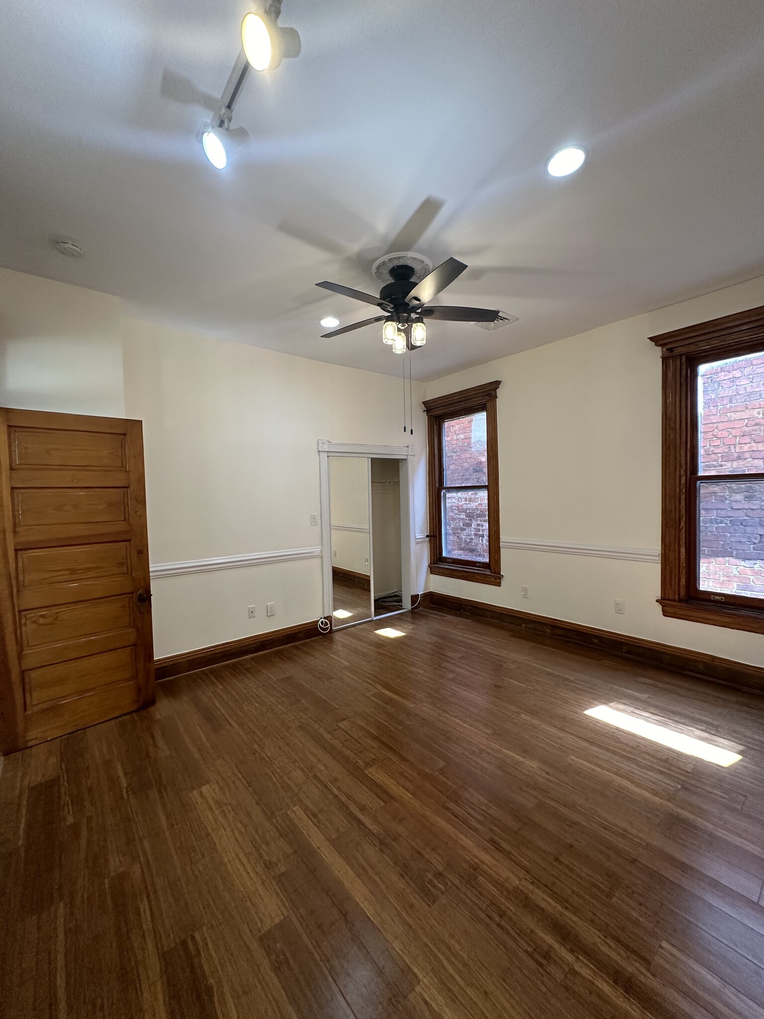 Bedroom1: closet, mirror, fan - 2329 W Grace St