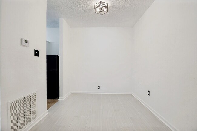 Building Photo - Spacious Dallas Condo with Unbeatable Storage, Private Patio & Carport