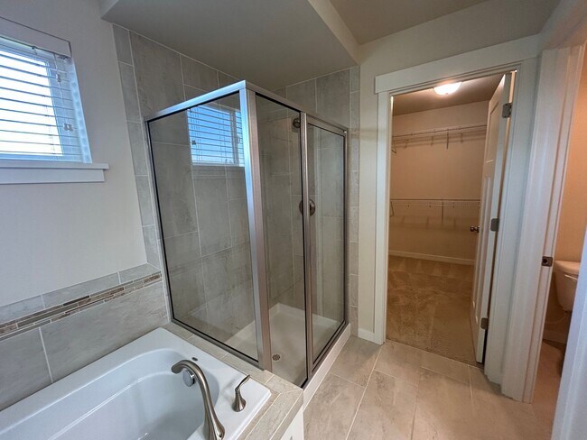 Building Photo - 4 bed/2.5 bath and 3 car garage and a down...