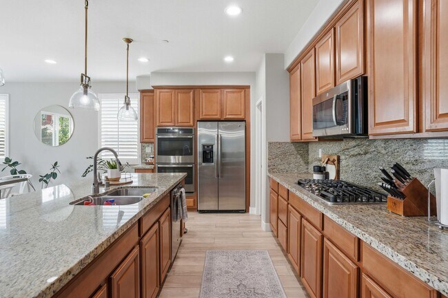 Building Photo - Highly Sought-After Next Gen Home with Private Downstairs Suite in Gated Valencia Community