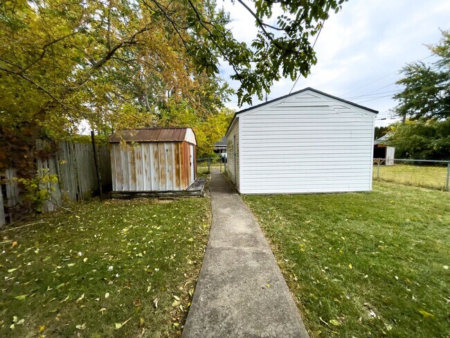 Building Photo - Fall into this cozy 3-Bedroom Home with a fenced in yard & detached garage!