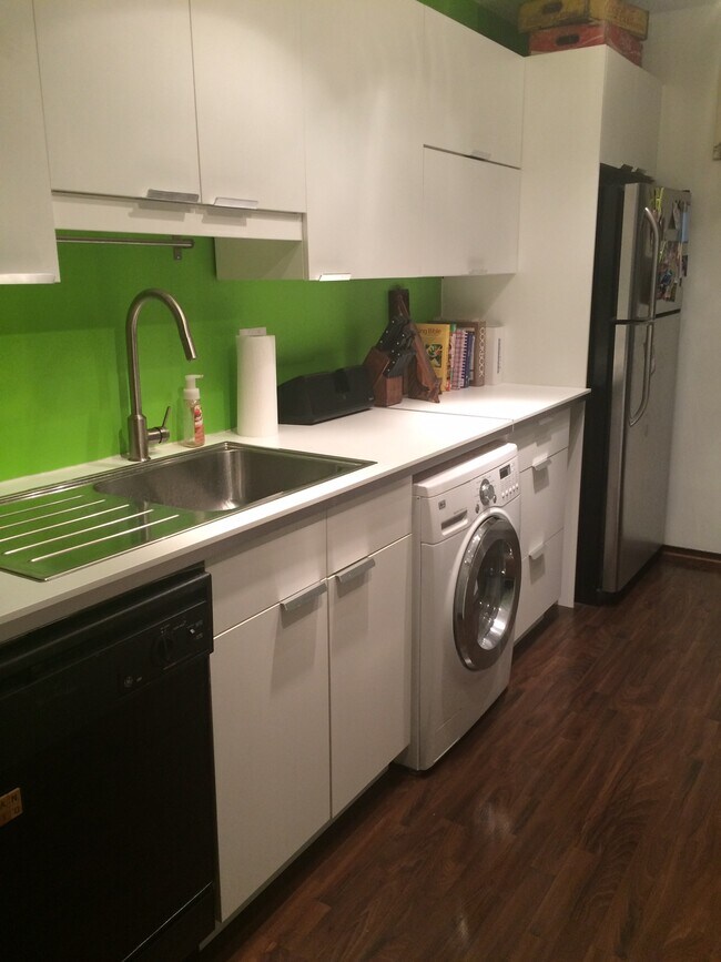 Beautiful kitchen with diswasher, and tuck-under washer and dryer combo unit. - 132 Demont Ave. East