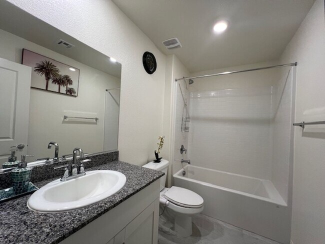 Building Photo - FULLY FURNISHED!!! beautiful 3 bedroom 2 and half bath home is located in the Symmetry Bay Cadenc...