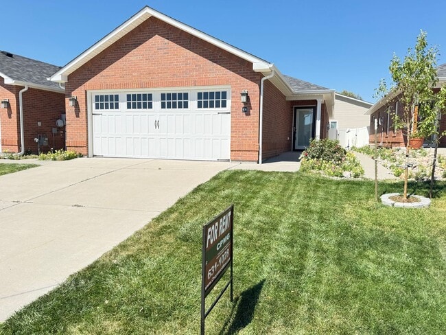 Building Photo - 4 BEDROOM, 3 BATHROOM TWINHOME WITH 2 CAR ATTACHED GARAGE IN NORTH CHEYENNE