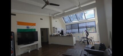 Building Photo - WATCH YT VIDEO BELOW! No Fee, Unique Skylighted PENTHOUSE!  Laundry in Unit!  Deck overlooking city!