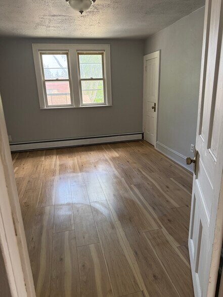 Master bedroom with walk in closet- new flooring - N89W15958 Main St