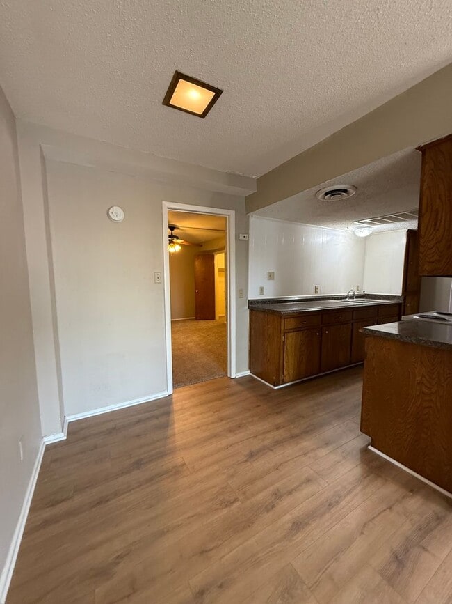 Building Photo - 1/1 NEW FLOORING ON-SITE LAUNDRY FACILITY-...
