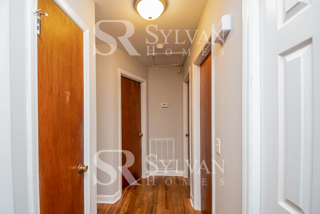 Building Photo - Welcome to this charming abode.