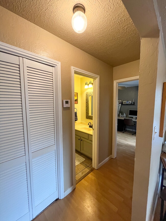Hallway view to laundry, bathroom and bedroom 2 - 421 W San Antonio St