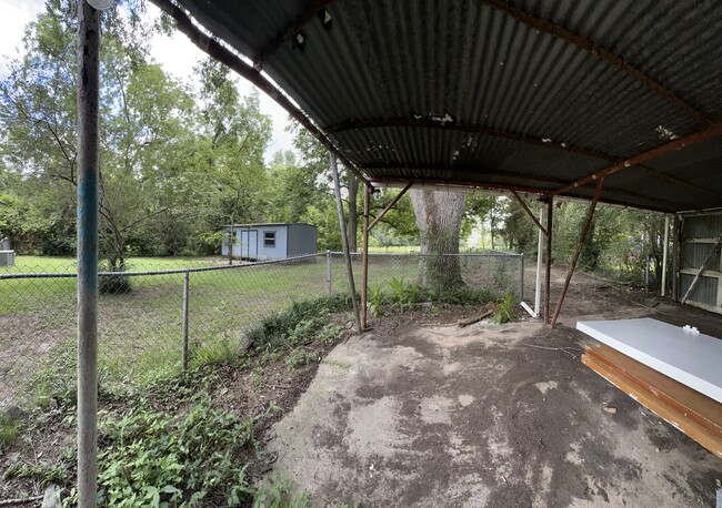 Outdoor shed, covered patio & parking - 516 W Point Tap Rd