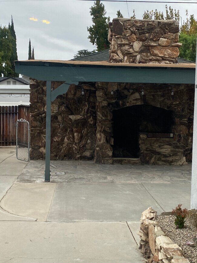 Outdoor fireplace under covered patio - 17423 Burbank Blvd