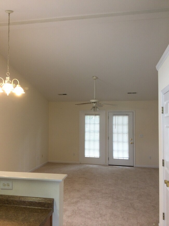 Building Photo - Updated flooring, McClelland Town homes 2BR/2Bath one level patio home, with back court yard! Clo...