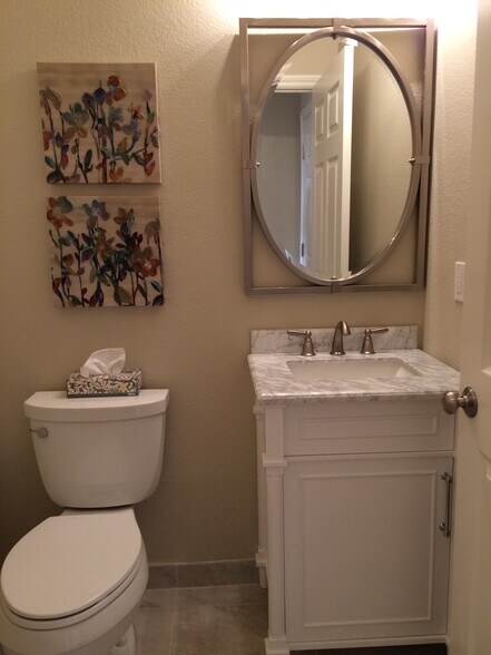 Guest half bathroom with new tile and vanity. - 203 Bean Creek Road