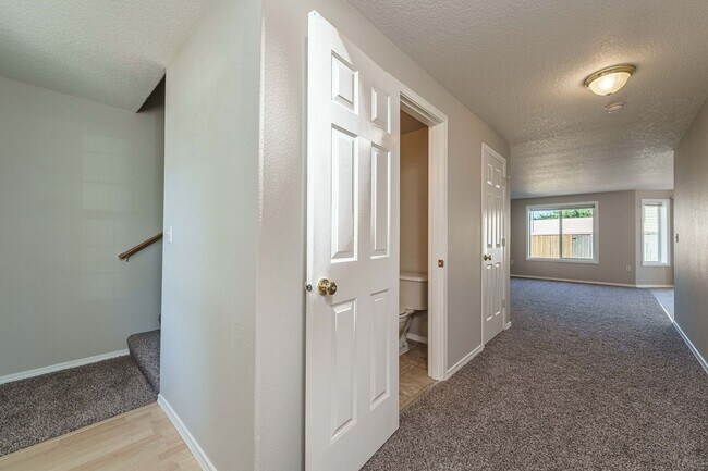 Building Photo - Your Next Home Awaits! 4BR/2.5BA with Fenc...