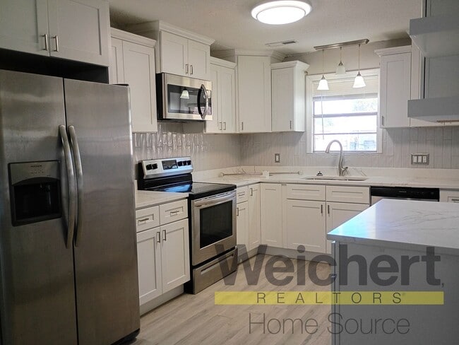 Building Photo - Updated 4-Bed Home with Fenced Yard & Carport