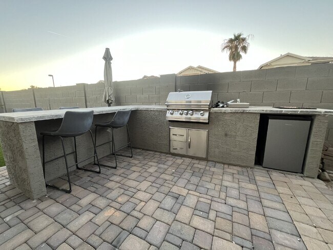 Building Photo - "Charming 4-Bed Oasis with Granite Touch & a Beautiful Pool"