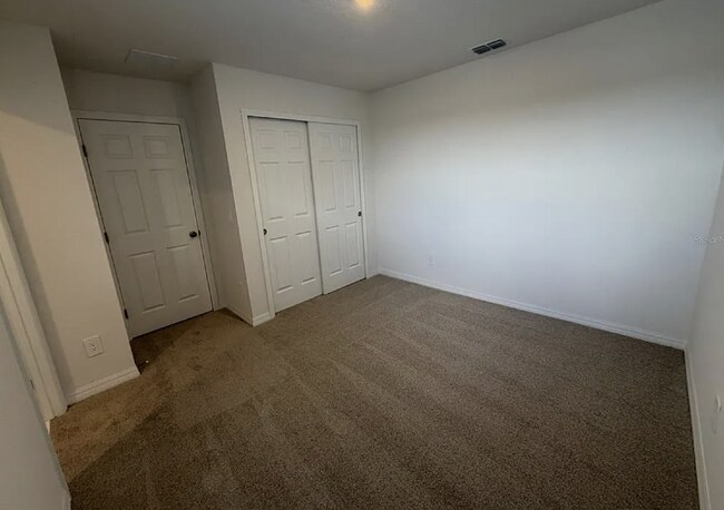 Building Photo - "Spacious 3-Bedroom Townhouse with Granite Elegance in St. Cloud – 4543 Rangeland Way"