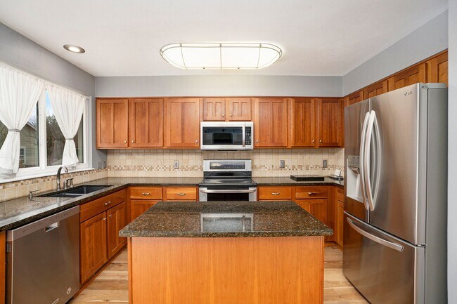 Building Photo - Spacious 4-Bedroom Home in District 20 with Huge Deck & Fenced Yard