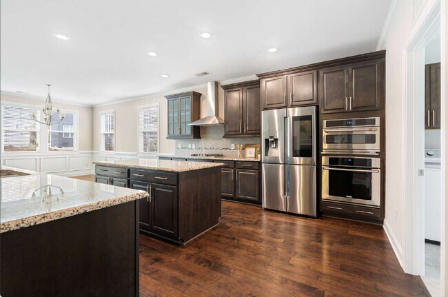 Building Photo - Luxurious 4-Bedroom Retreat with Third Floor Bonus Room & Fenced-in Backyard