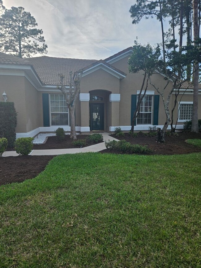 Building Photo - 4 BEDROOM 3 FULL BATH HOME WITH A SCREENED IN POOL IN THE BEAUTIFUL PALM COAST