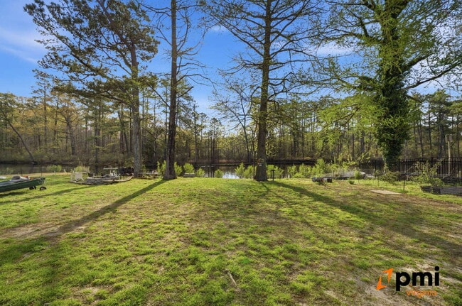 Building Photo - Stunning 5 Bedroom Waterfront Home with 2 car garage