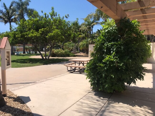 Building Photo - Beautiful Townhome with large fenced back patio, second story balcony, and two covered parking spots