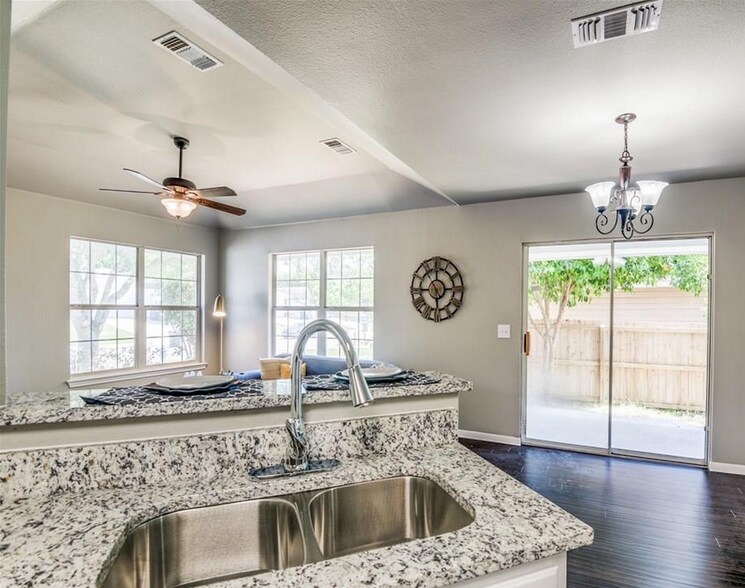 The open kitchen is great for entertaining friends and family. - 2066 Bentwood Dr