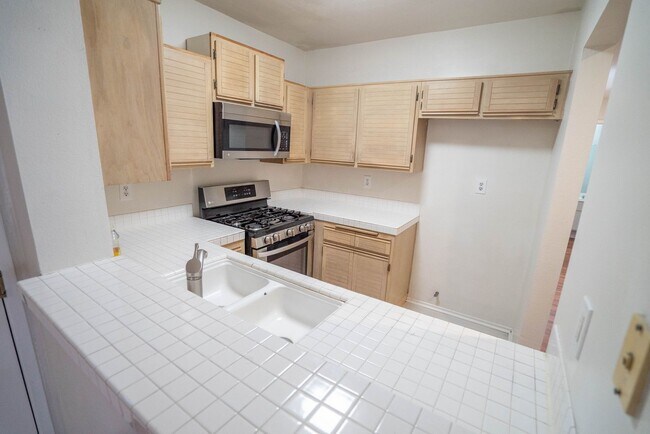 Building Photo - 2-Bedroom Condo with some Utilities Includ...