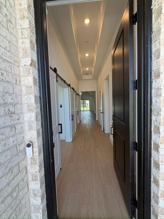 Building Photo - Move-in ready and like-new! Washer, dryer, and refrigerator Included.